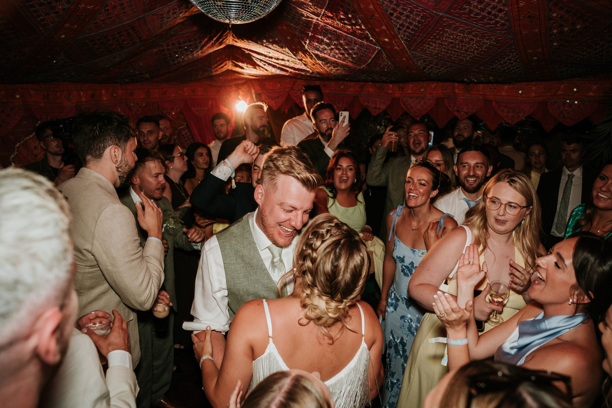 Guests dancing inside an Arabian Tents marquee
