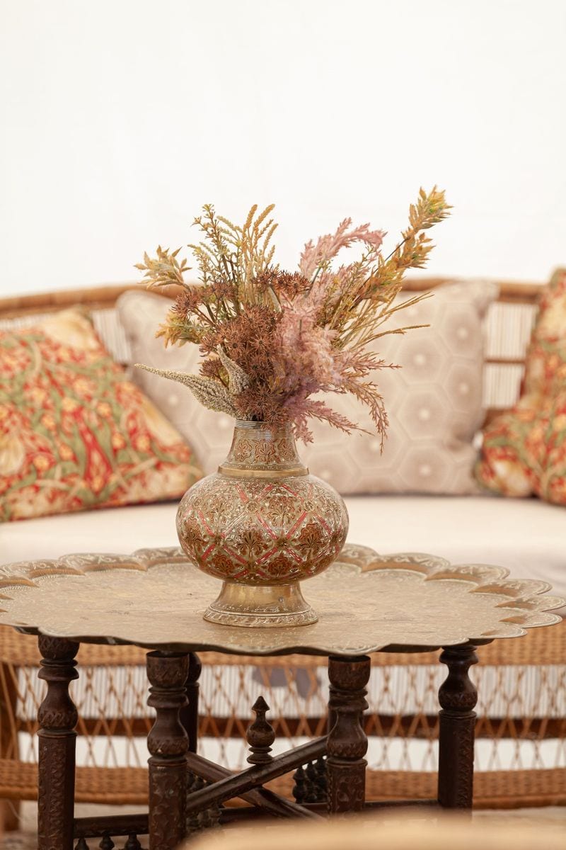 Brass vases with dried flowers