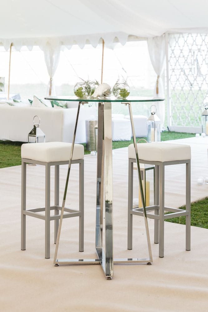 Contemporary glass and chrome poseur table